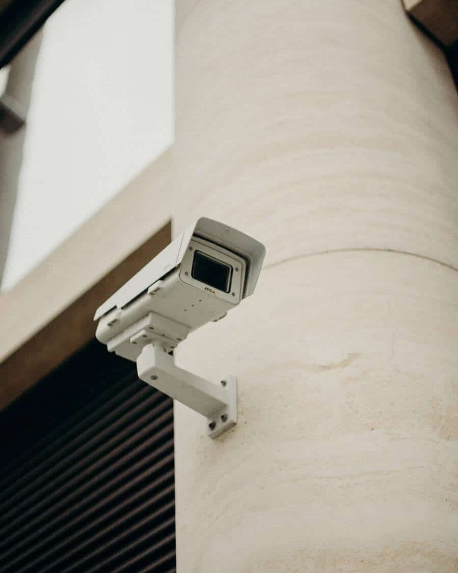 Security camera mounted to the side of a building